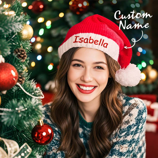 Personalised embroidered Santa hat with custom name on a classic red and white Christmas hat — perfect personalised name gift for family photos