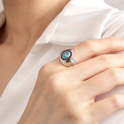 Detailed shot of engraved personalised text and chosen birthstone on a copper graduation ring — custom congratulations gift for classmates and friends