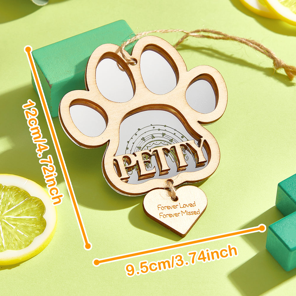 Multiple personalised pet memorial ornaments displayed together – solid wood custom dog paw keepsakes for pet lovers