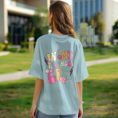 Smiling teacher wearing personalised 'In My Teacher Era' T‑Shirt – thoughtful personalised back-to-school gift for educators