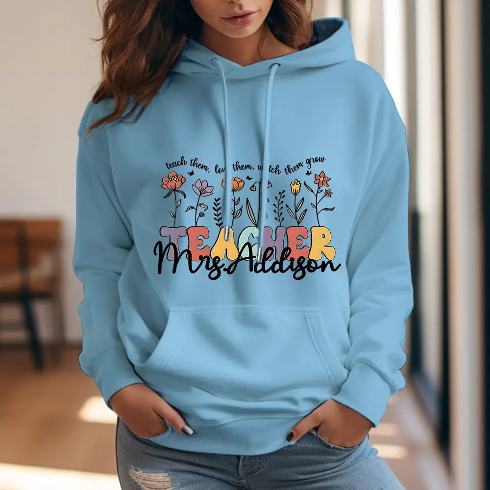 Close-up of the hood and neckline on the personalised wildflower hooded sweatshirt showing print finish — perfect personalised teacher gift