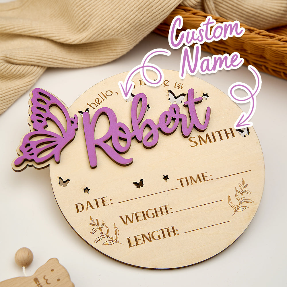 Close-up of personalised wooden butterfly birth announcement sign highlighting delicate engraving, natural wood grain and fine finish for baby shower keepsake