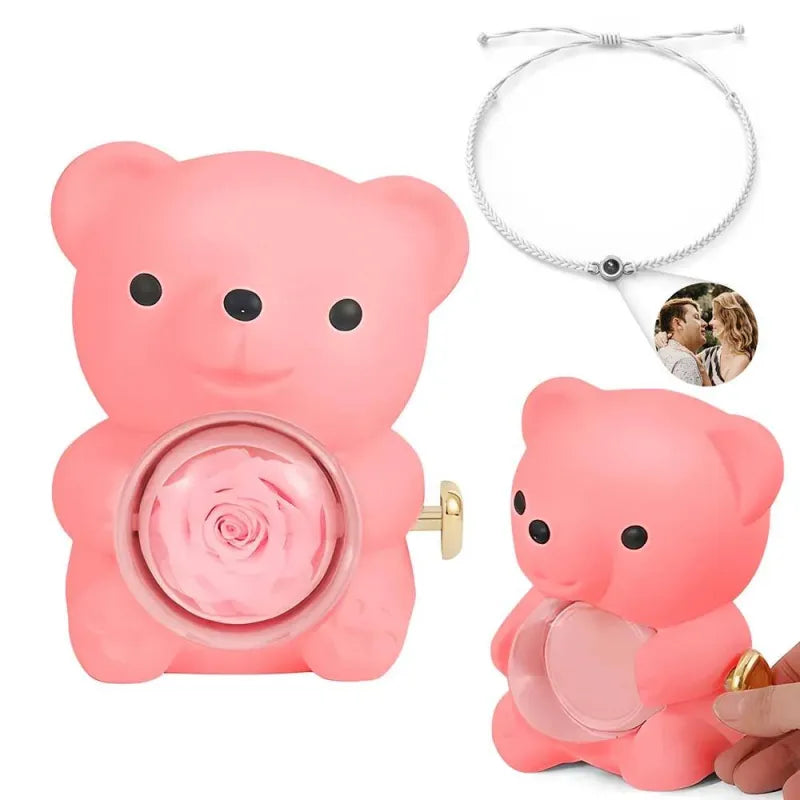 Flat lay of personalised photo projection bracelet with rose bear giftbox and presentation elements – ideal Valentine's gift set