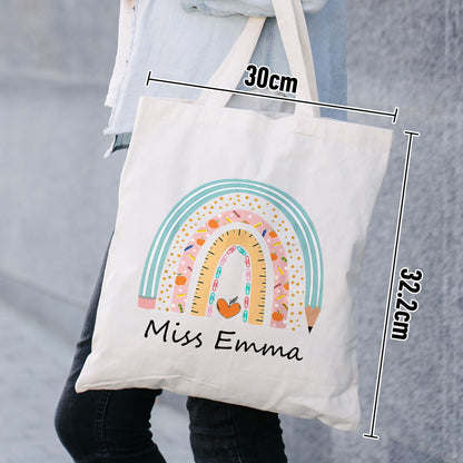Close-up of boho rainbow design and personalised name on canvas tote, showing neutral tones and quality print and stitching