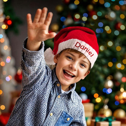 Close-up of stitched personalised name on a red embroidered Santa hat showcasing quality cotton fabric and neat embroidery