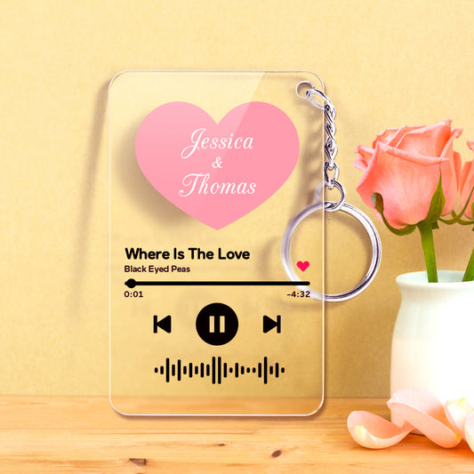 Personalised heart-shaped clear acrylic keyring with scannable Spotify code, custom song title and artist printed in pink and red – music acrylic keyring gift