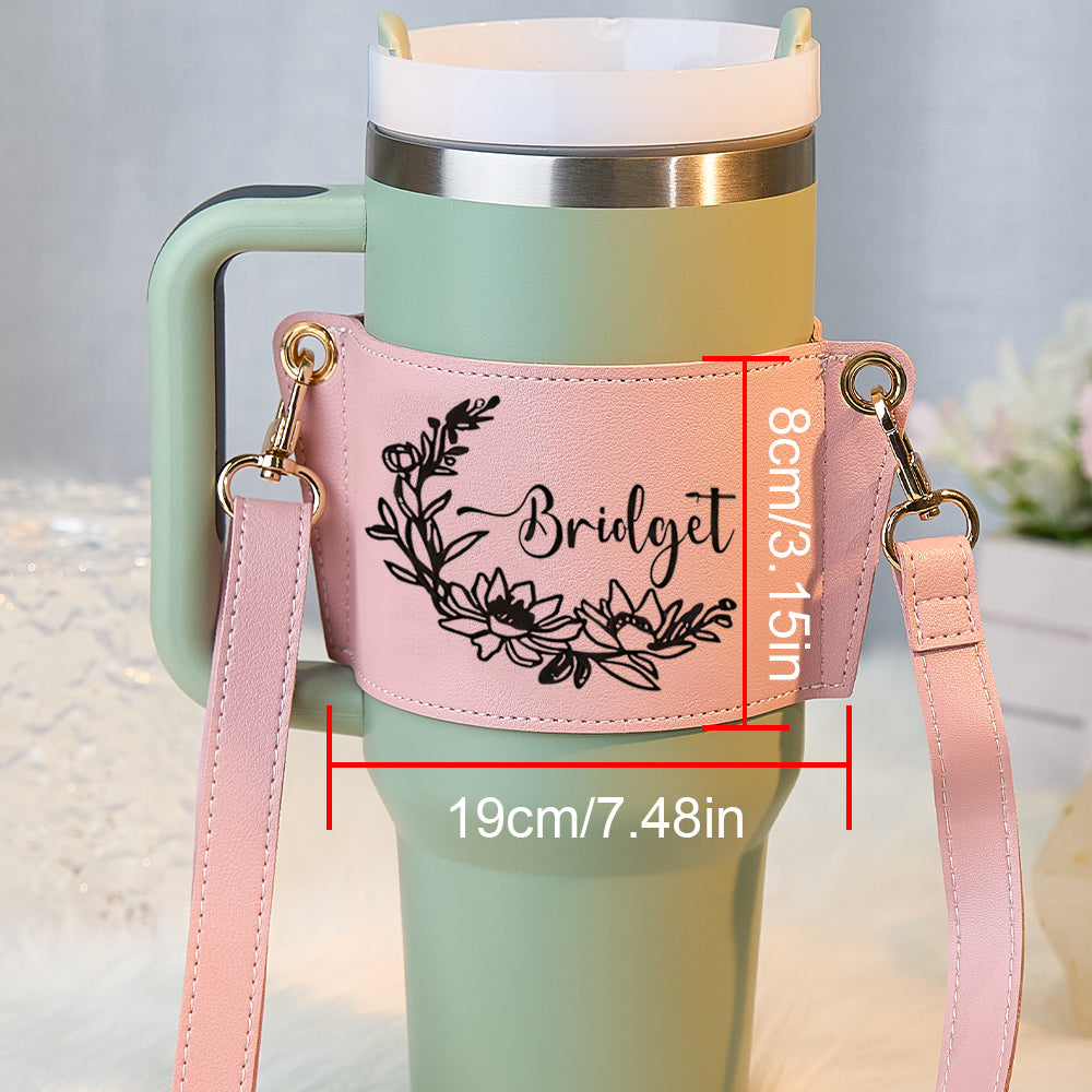 Flat lay of personalised floral 40oz Stanley tumbler carrier bag with tumbler and accessories ideal gift for her for travel or gym