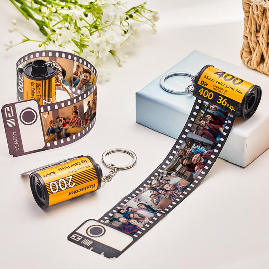 Close-up of a personalised film-roll photo keychain showing printed memories.