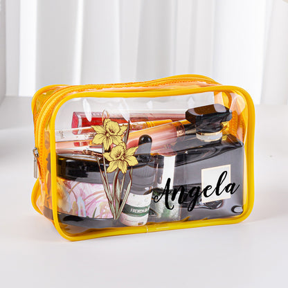 Open clear toiletry bag showing organised cosmetics and personalised birth flower print – practical travel toiletry bag