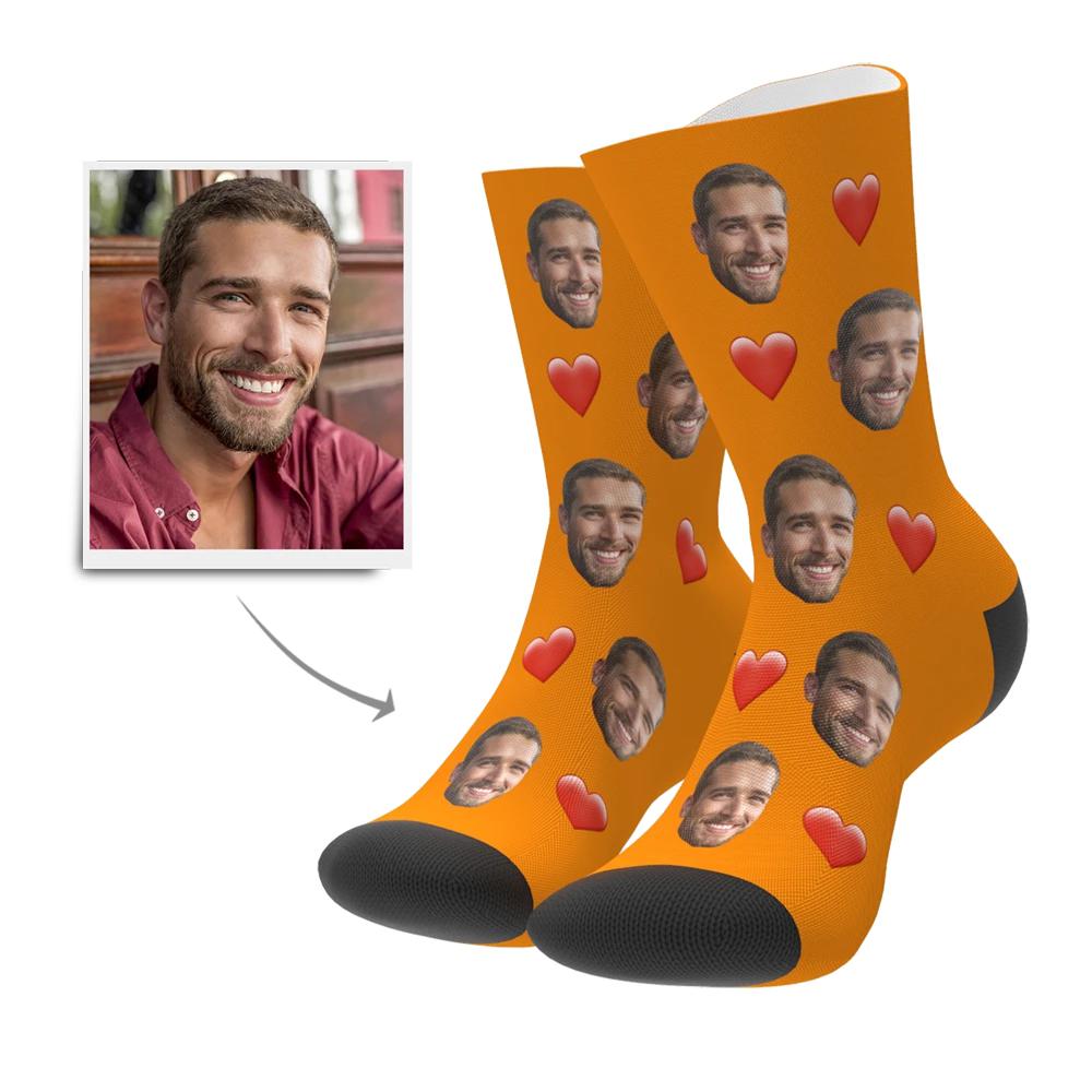 Child wearing personalised face socks with heart motif — kids size custom photo socks, great personalised gift for children