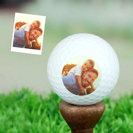 Personalised golf ball with photo printed on white dimpled surface – custom gift for golf lovers