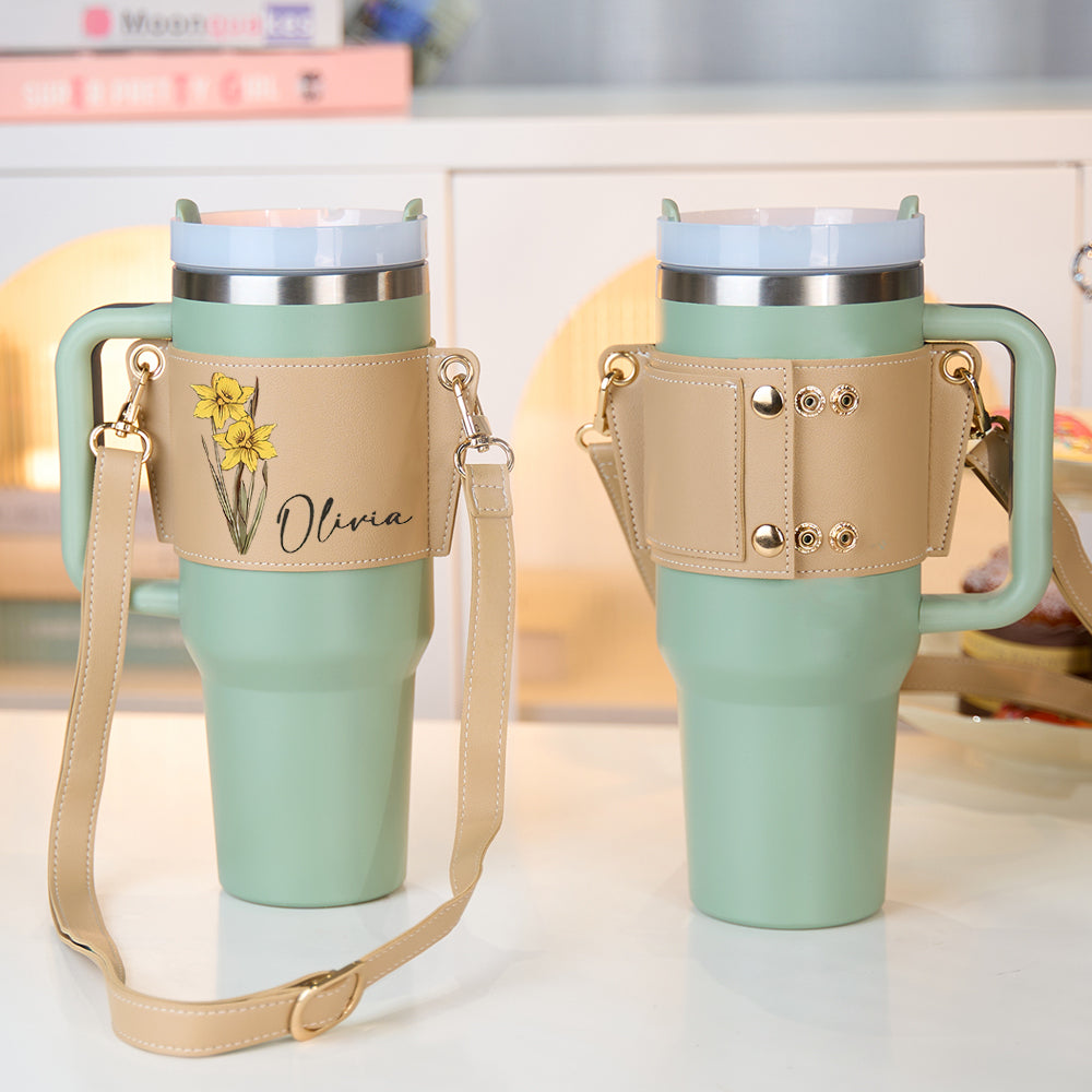 Side profile demonstrating secure fit of a 40oz Stanley tumbler inside the personalised birth flower PU leather carrier