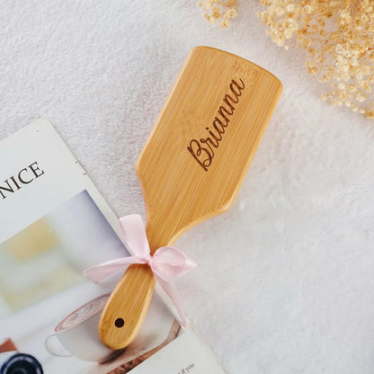 Back view of bamboo detangling brush showing smooth finish and personalised engraving area – durable, lightweight and travel-friendly