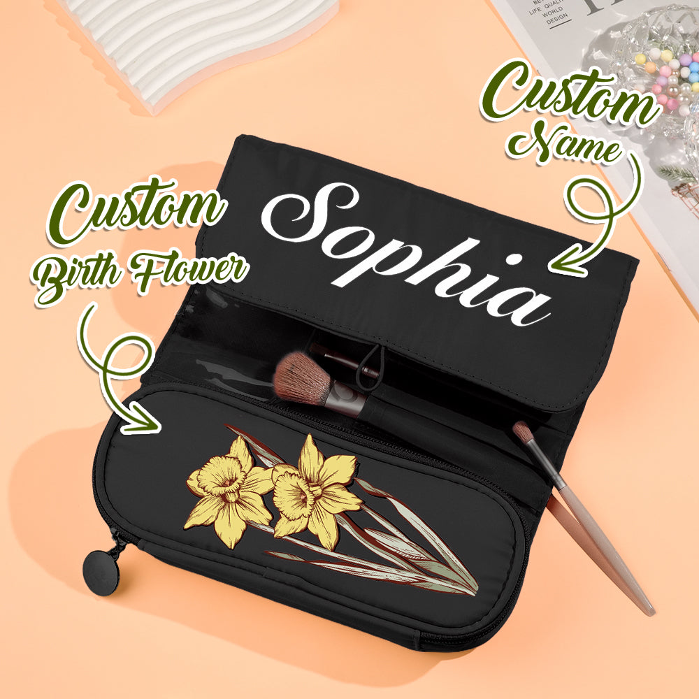 Hand holding personalised birth flower make-up brush bag to show scale — 22cm x 10cm compact nylon cosmetic pouch