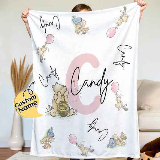 Personalised Winnie the Pooh name blanket in soft flannel, a cosy nursery throw customised with a child's name.