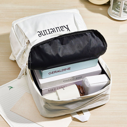 Detail shot of secure zip closures and durable hardware on personalised embroidered backpack, highlighting reinforced seams for long-lasting wear