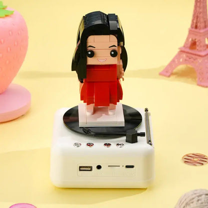 Multi-angle gallery of the customisable one-person brick figure and Bluetooth speaker base showing front, side and rear views — ideal personalised gift