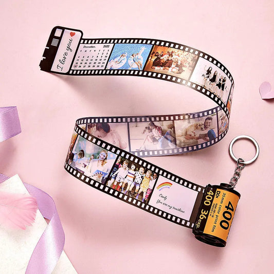 Personalised camera-roll keyring displaying a row of custom photos with personalised date and text – retro photo keychain gift