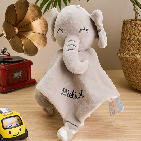 Close-up of embroidered name on a personalised baby comforter featuring a plush rabbit design.