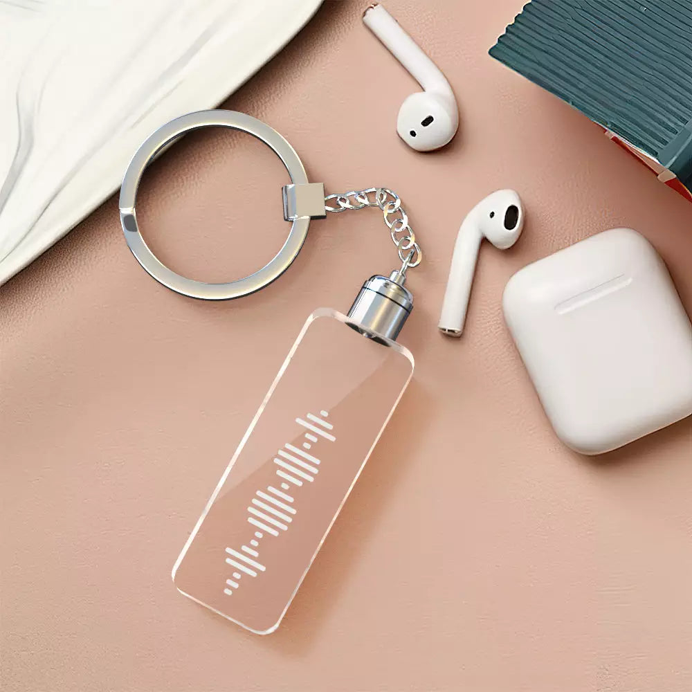 Close-up of custom song shiny acrylic keyring showing clear music code and personalised text — perfect romantic keepsake or memorial gift