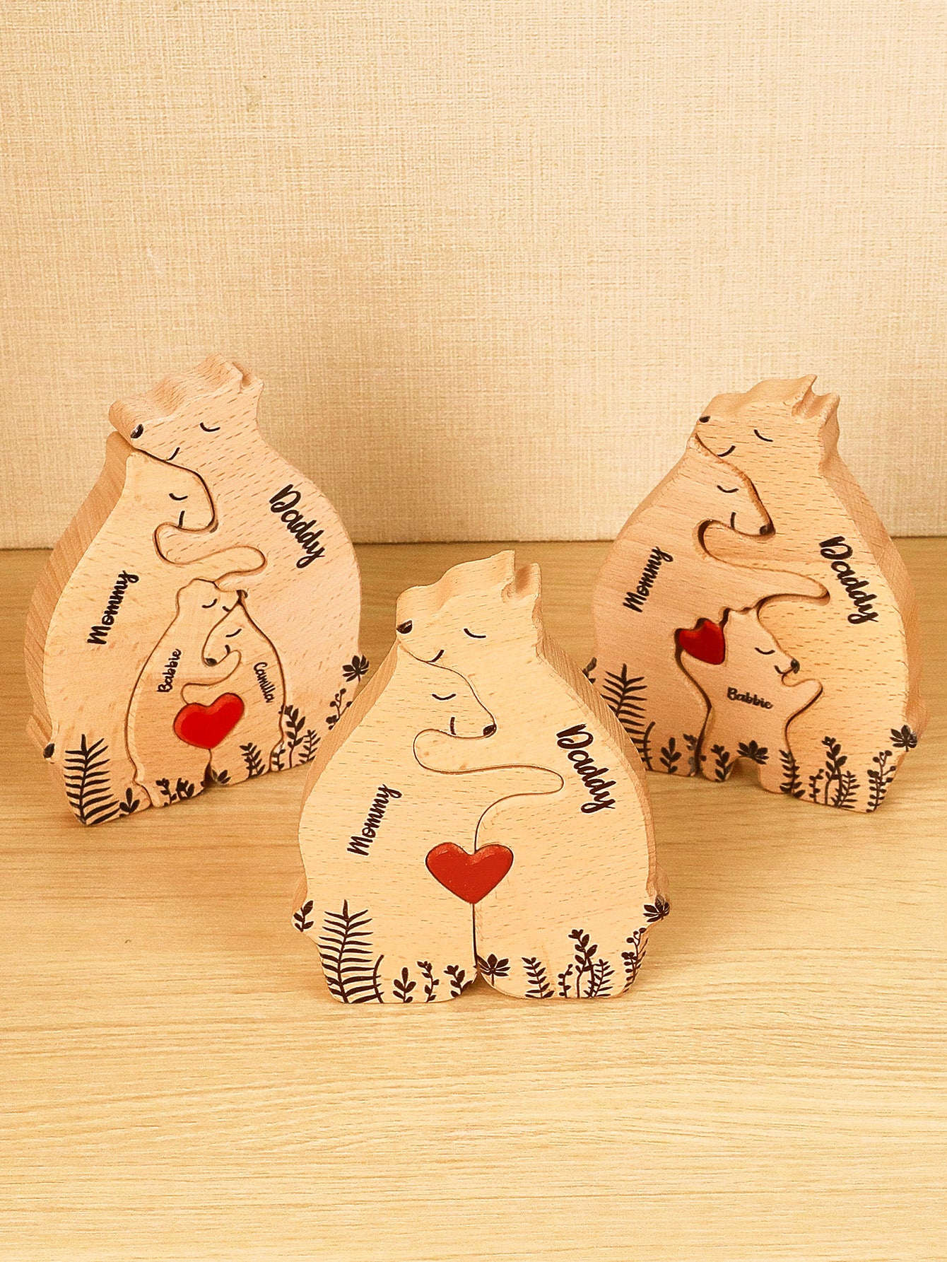 Family arrangement of personalised wooden heart bear puzzle pieces forming a heart – custom name family keepsake