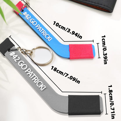 Top‑down profile of a 3D‑printed hockey stick keyring showing blade and handle detail — personalised keepsake with smooth finish