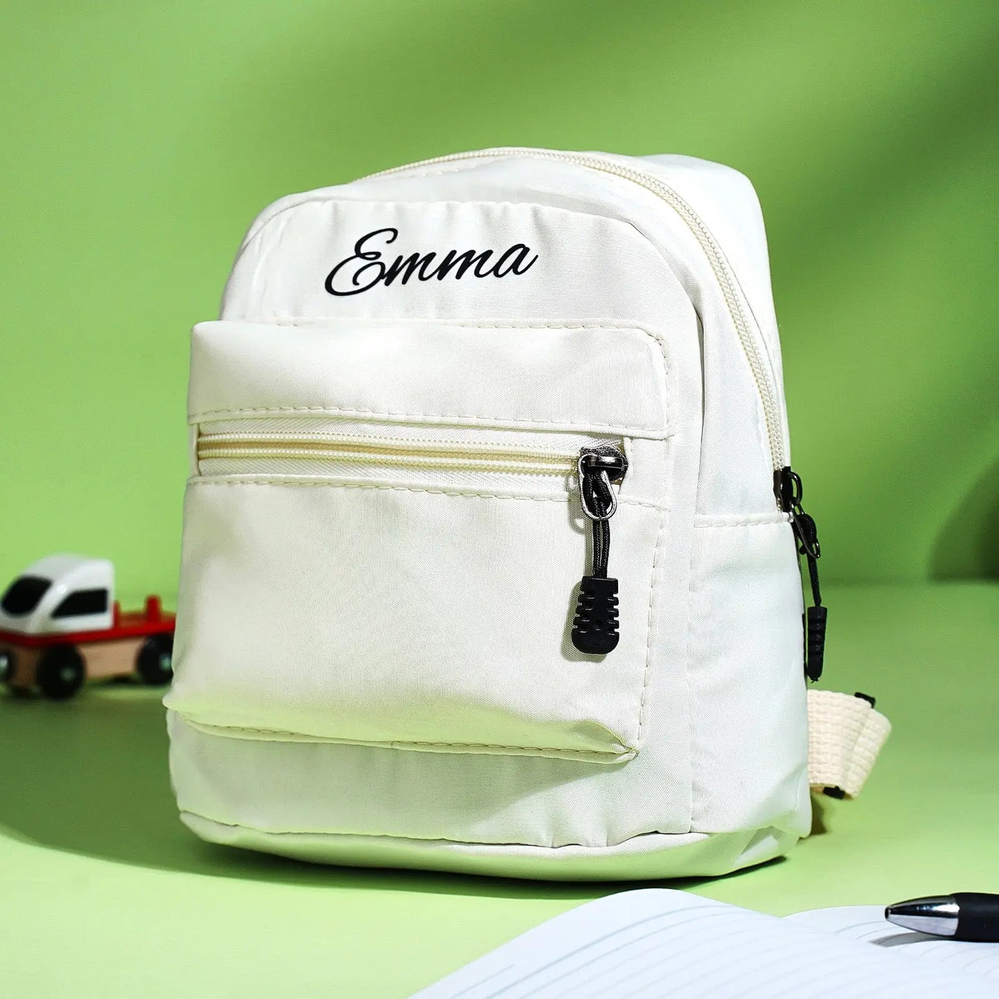 Rear view of personalised mini backpack showing padded straps and neat stitching — compact lightweight school bag for kids