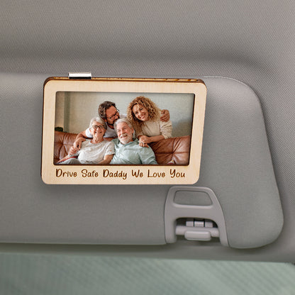 Close-up of the natural wood frame with magnetic backing for sun visor attachment.