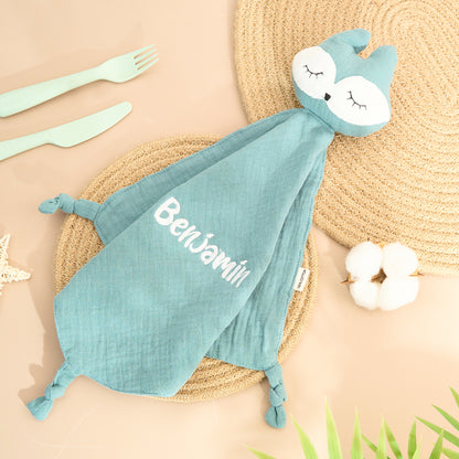 Close-up of embroidered name on personalised baby comfort towel showing neat stitching and soft cotton texture — ideal baby shower gift