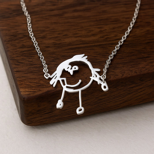 Close-up of the Personalised Line Art Necklace pendant showing a custom line drawing engraved on copper with a minimalist style.