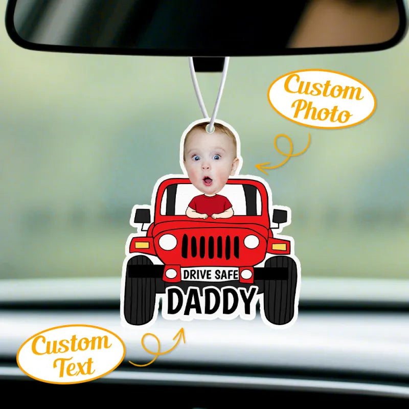 Detail view of the customised car air freshener showing its text area and felt material.
