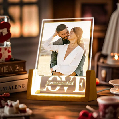 Personalised photo night light with laser‑engraved couple portrait on an acrylic panel and elegant wooden base, warm LED glow — custom couple anniversary lamp