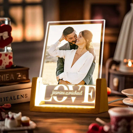 Personalised photo night light with laser‑engraved couple portrait on an acrylic panel and elegant wooden base, warm LED glow — custom couple anniversary lamp