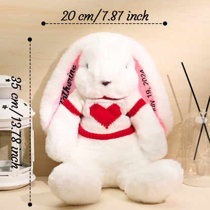 Detail of jumper stitching and embroidered lettering on personalised rabbit teddy – thoughtful personalised name gift
