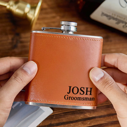 Personalised 6oz whiskey flask wrapped in premium PU leather with deep engraved name on stainless-steel body — perfect groomsmen or father gift