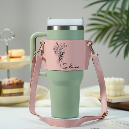Front view close-up of personalised birth flower design and custom name on PU leather 40oz tumbler carrier — perfect for Mother's Day or birthdays