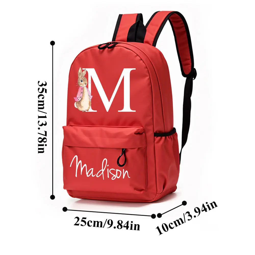 Side view showing external zip pocket and neat stitching on personalised rabbit school bag – practical storage for lunch or small toys