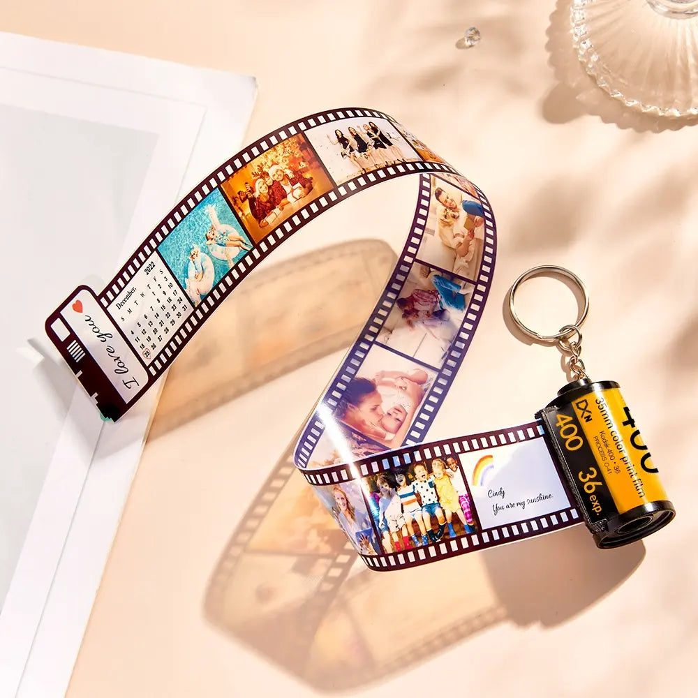 Close-up of personalised camera roll keyring showing high-definition printed images and solid metal key ring – custom photo keychain