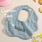 Personalised cotton baby bib with embroidered name on a white background — perfect newborn gift and baby shower present