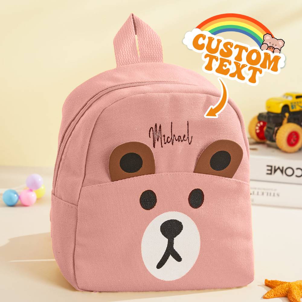 Child wearing personalised mini bear backpack – custom kids school bag sized for preschool and play