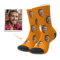Pair of personalised photo socks showing custom face print — high-quality heat-transfer, available in ten colours