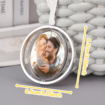 Lifestyle shot of the personalised photo rotation ornament in a car interior during travel.