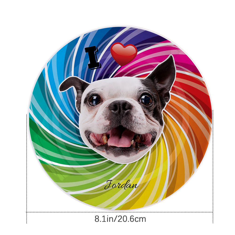 Colourful personalised dog-face plate displayed on a table stand, showing custom photo print and name — ceramic pet dinnerware ideal as a gift