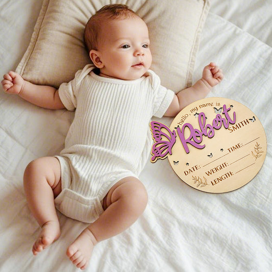 Personalised Butterfly Birth Announcement Sign wooden photo prop showing engraved name and birth details on butterfly-shaped plaque, newborn photography prop and nursery keepsake