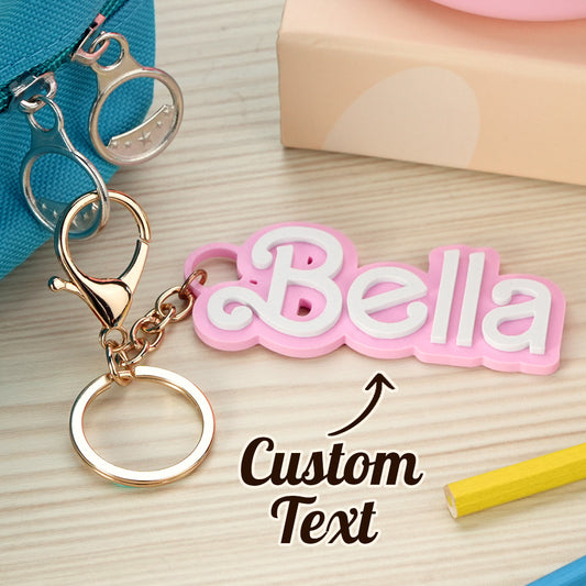 Personalised backpack name tag in bright colours hanging from a school rucksack showing custom engraved name kids' bag charm back to school gift