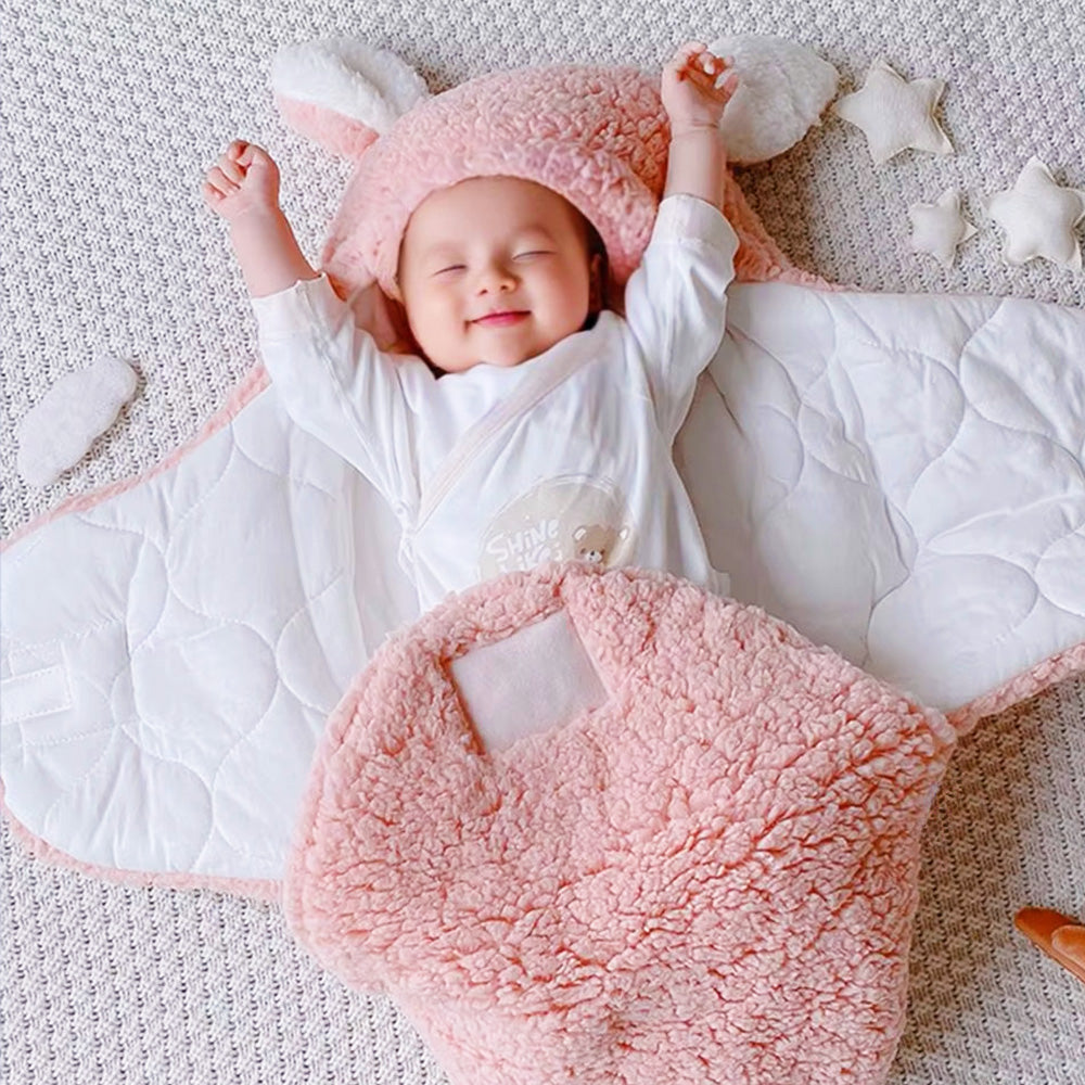 Personalised bunny baby swaddle with name in premium lamb wool; hooded with bunny ears for warmth and a charming photo-ready look.