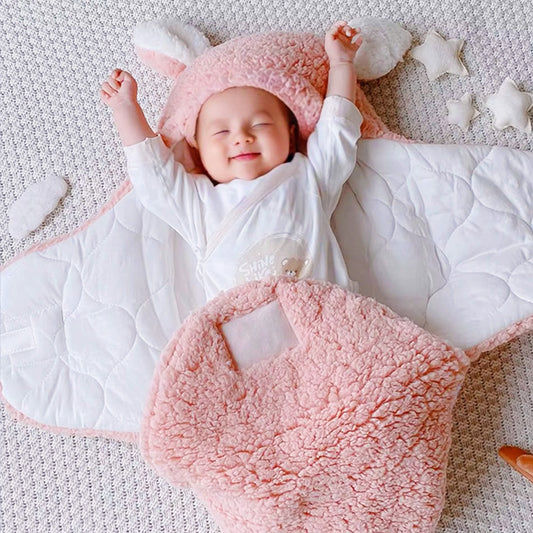Personalised bunny baby swaddle with name in premium lamb wool; hooded with bunny ears for warmth and a charming photo-ready look.