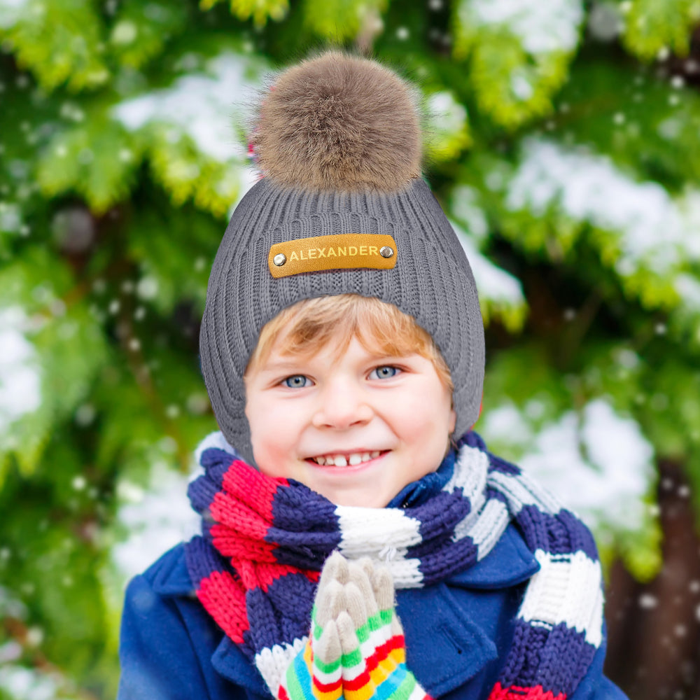 Close-up of soft acrylic knit on personalised beanie — breathable, stretchy material for newborns and young children