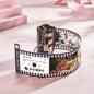 Durability demonstration of the personalised film reel keychain — over 10,000 rotations tested for reliable daily use