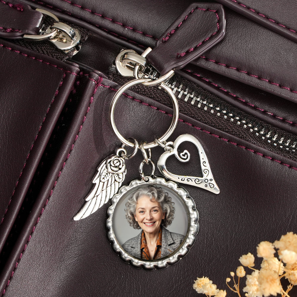 Detail of keyring and chain on personalised photo heart wing keychain highlighting sturdy alloy construction
